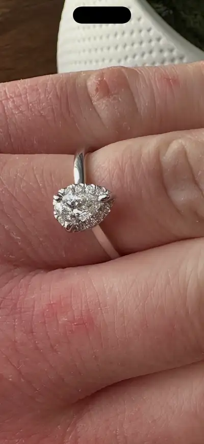 Beautiful 14K gold engagement ring in like-new condition. • Size 7 • Total diamond weight: 0.66 CT •...