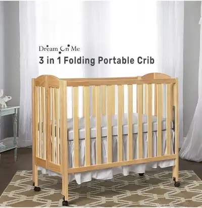 "BRAND NEW" Folding Mini Crib, View more