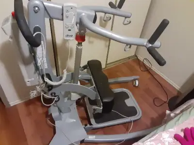 Sit to stand machine operates with plug in battery pack $ 1599 Sling sold separately $199 Lifts pati...