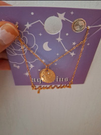 NWT 2 gold tone Aquarius Necklaces 