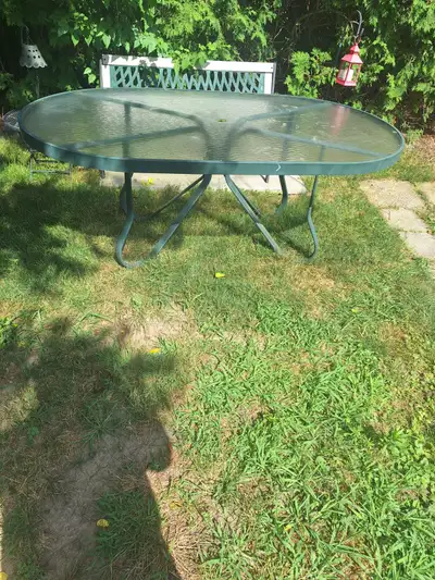 Large glass patio table in excellent condition, View more
