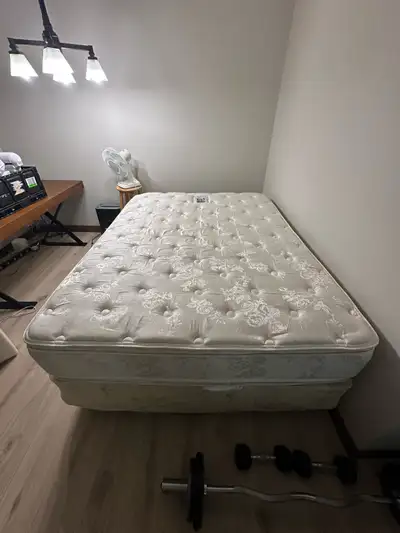 Sealy king size mattress with a box spring and metal frame., View more