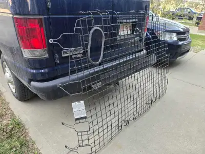Wire partition that came out of a 2012 Ford E150 but should fit E250 and E350 vans. Divides cargo co...