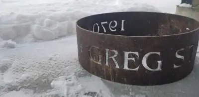 Roast marshmallows in style with this personalized fire pit! It's designed with the name "GREG STYLE...