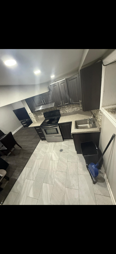 This clean and well-maintained basement apartment features modern laminate flooring, a functional ki...