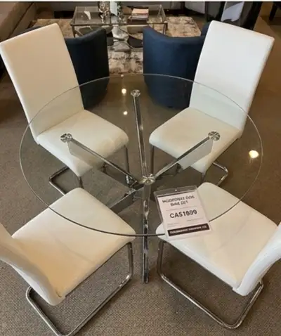 Upgrade your dining space with this elegant glass dining set featuring a sturdy chrome base and 4 co...