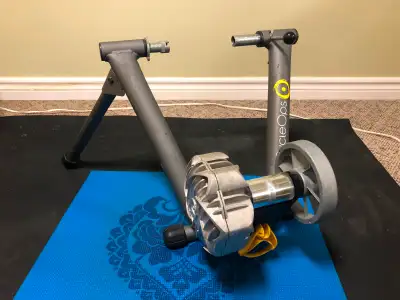 Indoor bike trainer with front stand. In original box. Missing skewer.