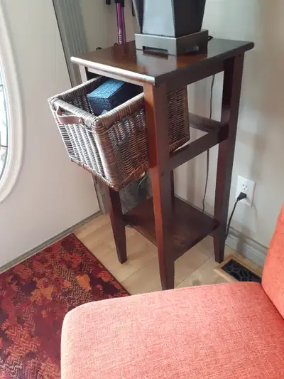 Tall narrow cabinet with wicker drawer. Perfect for confined spaces. Measurements are 33" high, 14"...