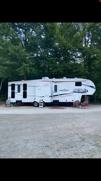 37 foot fifth wheel trailer with rear garage to hold your golf cart, atv, couple dirt bikes. Trailer...