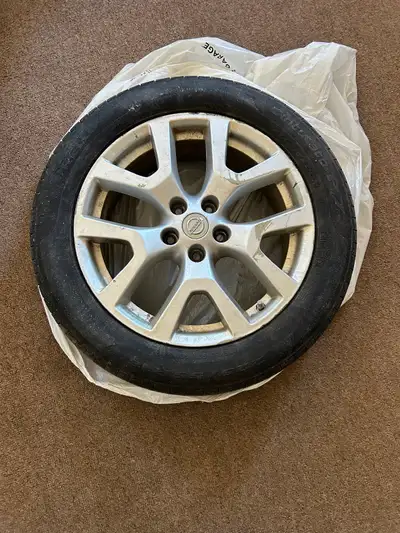 Set of 4 Nissan rims and tires from Nissan rogue. Tires have about 50% tread life. Rims are scuffed...