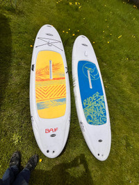Two white stand up paddle boards 10’