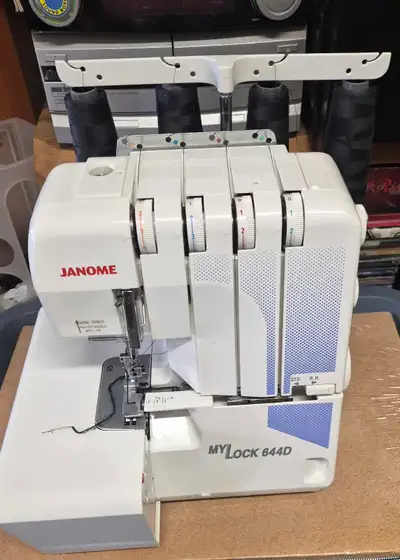 This is a Janome MyLock 644D serger sewing machine, perfect for adding professional-looking edges to...
