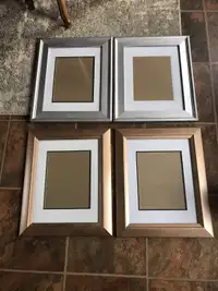 Two sets matching picture frames 