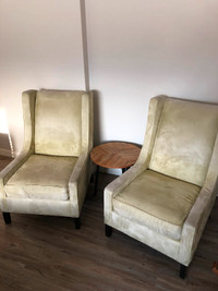 2 light green armchairs