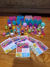 BUNDLE OF 49 SHOPKINS WITH BAGS AND CARTS