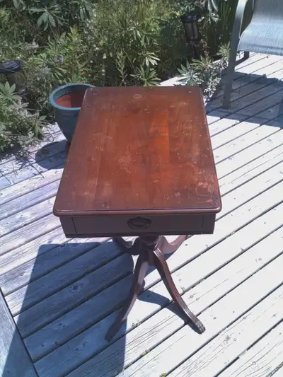 Antique side table with drawer. Solid and sturdy. Has scratches and wear marks. Moving ,so am sellin...