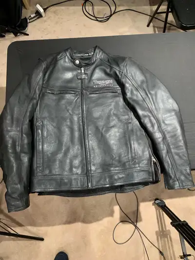 Here is a Triumph Motorcycle Leather Jacket, boasting both style and protection for riders. This jac...
