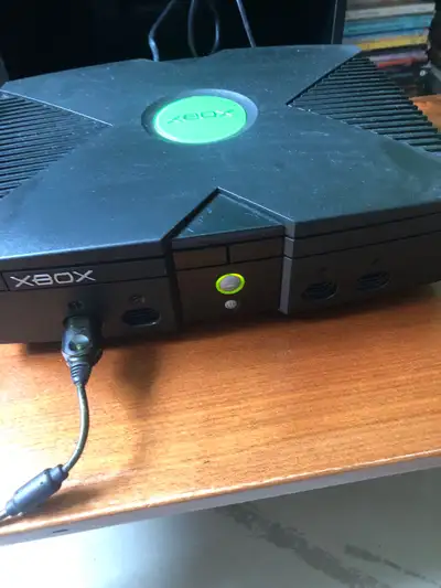 Revive the classic gaming era with this fully functional, original Xbox console bundle, including a...
