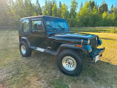 1992 Jeep YJ. Well look after, 5 speed, stick shift, 4 cylinder, fuel injected, 4x4, two soft tops a...