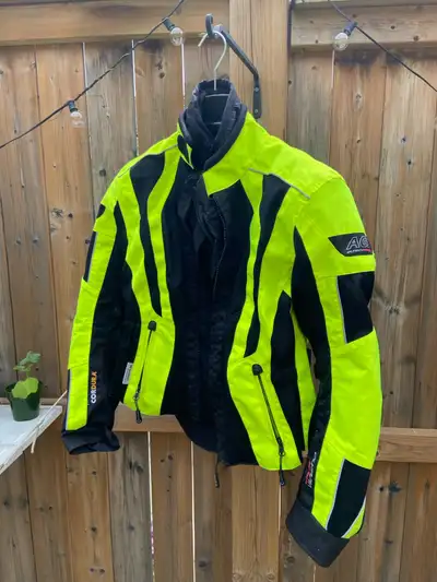This pre-owned Women’s Olympia AG5 Motorcycle Jacket, size small, is designed with high-visibility n...