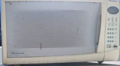 Vintage white inverter microwave ( not sure if working) Location - Farm yard west. PLEASE read the a...