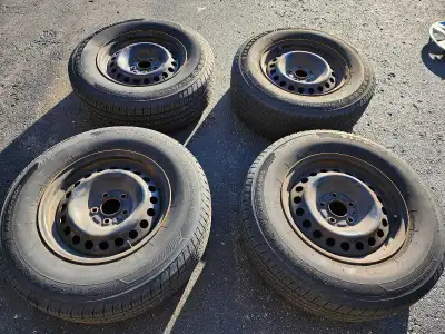 4 P235/70R16 all season Firestone tires on steel rims. Lots of life left in tires, hubcaps and rims....