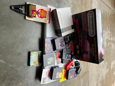 Nintendo NES System - Action Set, in original box plus 5 games Includes two Nintendo controllers and...