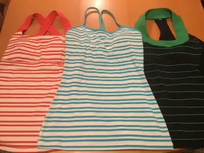 Three Lululemon women’s athletic tops, size 4., View more