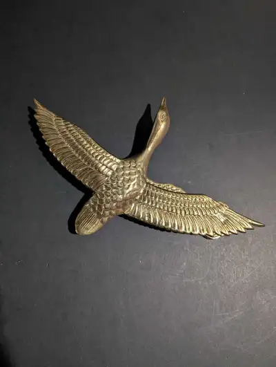 Vintage solid brass in flight goose duck door knocker. Goose or Duck bird. MCM style. Measures appro...