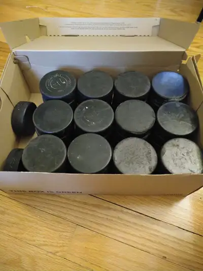 50 Used Hockey Pucks, View more
