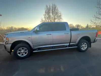 This 2022 Dodge Ram 2500 Laramie is a pickup truck with a robust diesel engine and luxurious feature...