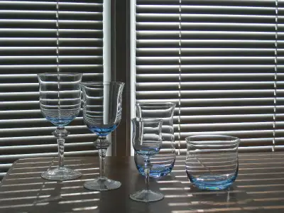 Denby Aurora crystal (blue) 8 liqueur 8 water 8 highball 4 red wine 4 white wine -2 pieces have slig...