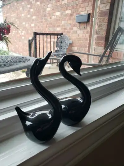 This is a beautiful pair of black glass Swans in good condition. They are 5" tall and 3" long. If yo...
