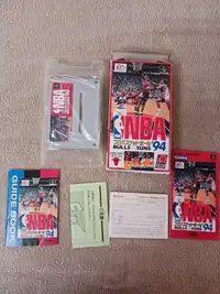 2 Famicom games  NBA 94 the other is a racing game 