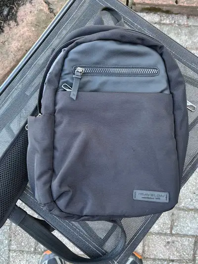 I am selling a Travelon sling body pack. It's an anti-theft bag with RFID blocking technology and a...