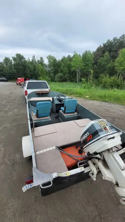 16 foot Blue Fin Boat with a 30hp Johnson Outboard with console steering. - all wood in the boat was...