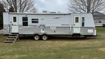 30 ft camper with double slide out, sleeps 6, new fridge, electric jack, 4 new stabilizer jacks, lot...