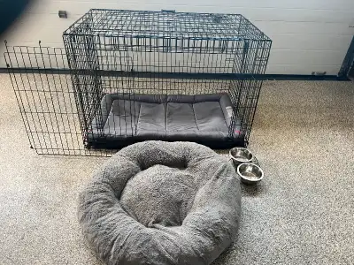 48”Lx32”Hx30”W metal Kong dog crate with pad liner. Comes with divider, dog bed and dish. Excellent...