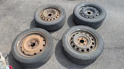 Mainly selling for rims, four 205/55R/16 studded snow tires on steel rims. The rims are in good shap...