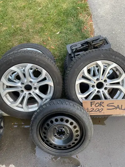 Great condition. Barely Used. Lots of tread. Michelin Winters On all 4. Spare and jack included. Get...