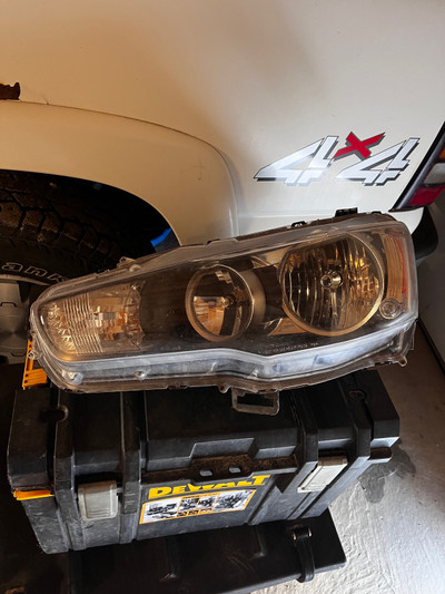 Mitsubishi lancer left side headlight 