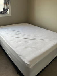 New queen size mattress with bed frame and box