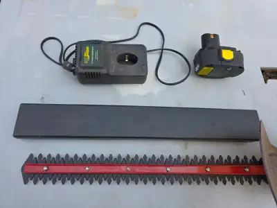 For sale an older Yardworks 18V Cordless Hedge Trimmer Tool Battery And Charger. The battery doesn't...