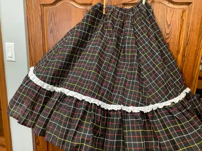 Ladies square dancing skirts $15 each First one is black plaid with an elastic waist and eyelet trim...