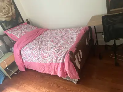 This is a room for rent in a house containing furniture and a bed. It is cozy room perfect for a fem...
