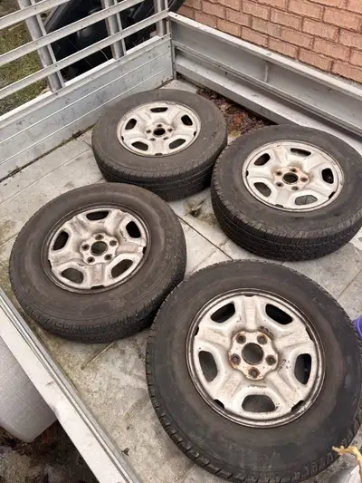 Steel rims and tires from a small Toyota Tacoma 215/70R15