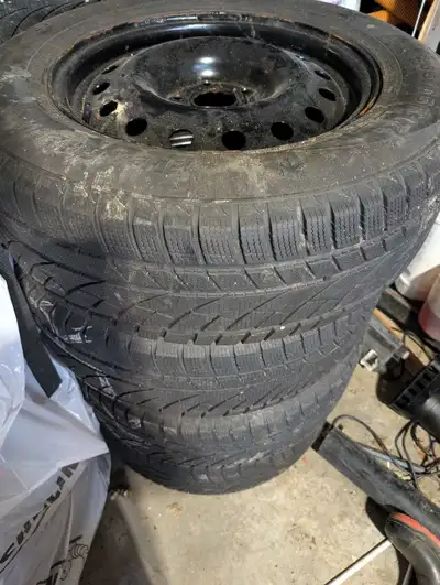 These are used winter tires, size 235/65R17. They come mounted on steel rims and are ready to be ins...