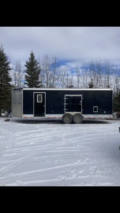 Enclosed heated insulated sled trailer 12 volt and 110 volt lights, spring assist doors , electric j...