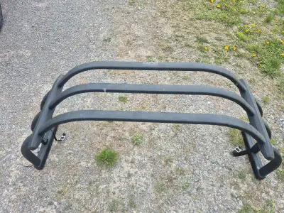 Truck bed extender with mounting hardware for a 2017 GMC Sierra.
