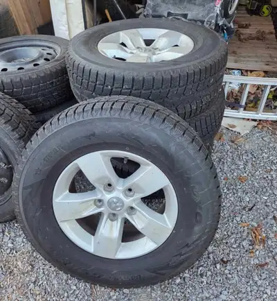 Factory dodge ram rims (5 bolt) in great condition bran new tires used for one month last season wen...
